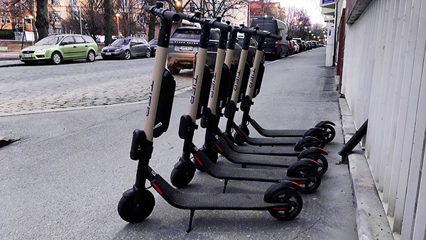 Row of e-scooters - people injured on or by a Bird Scooter can bring a lawsuit seeking damages