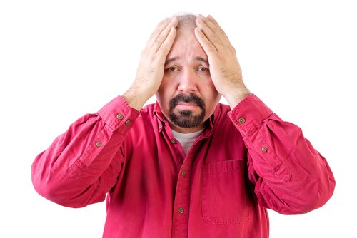 disconsolate middle-aged man in red shirt