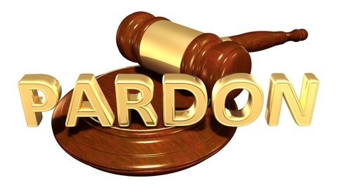 Word “pardon” superimposed over judge's gavel