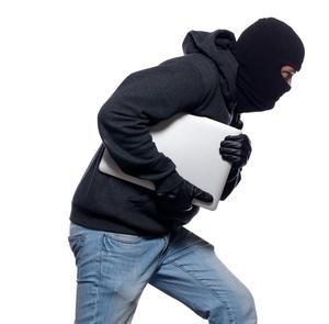Looter stealing laptop