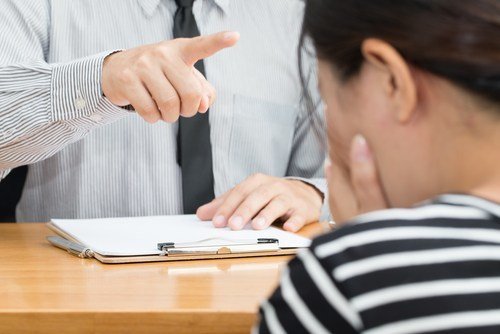 man intimidating a witness