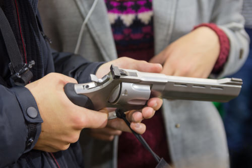 man holding a revolver