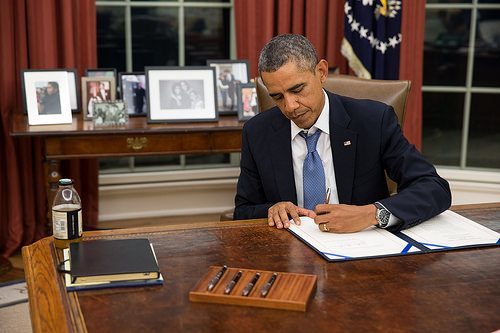 President Obama signing a bill