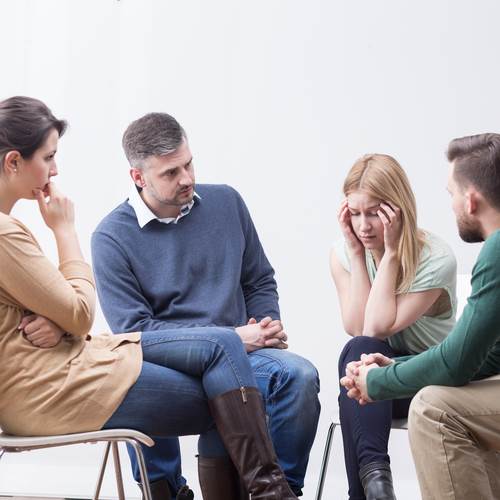 group therapy session with four participants