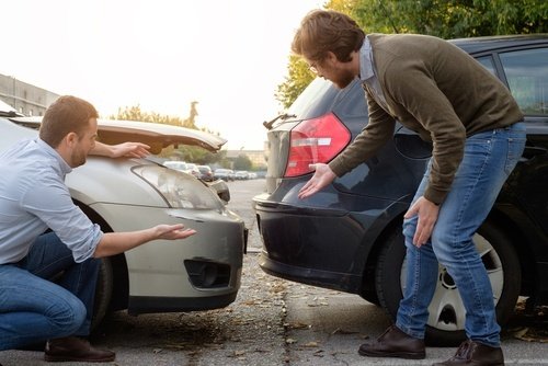 Two motorists arguing after being involved in a rear-end collision