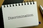 sign that says discrimination 