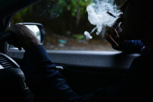 Driver smoking weed in car