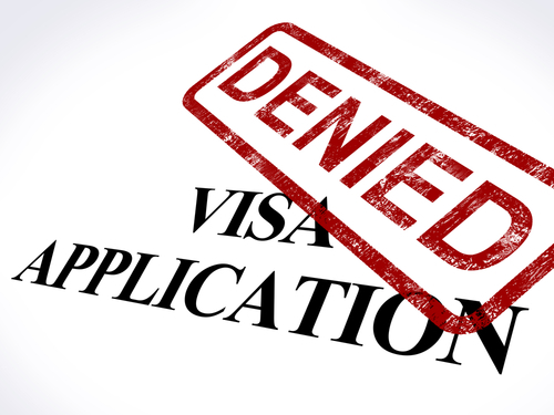 Paper marked "visa application" and stamped "denied"