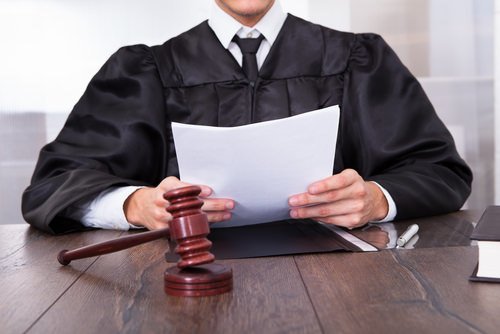 judge holding documents during resentenicng hearing