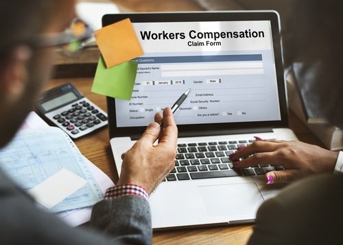 Workers compensation claim form on laptop computer