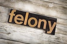 sign that reads "felony"