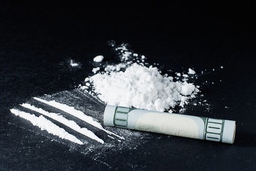 cocaine lines and a rolled up hundred dollar bill - unlawful possession of a controlled substance is a crime under California Health and Safety Code 11350(a) HS