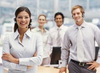 Group of four receptionists wearing headsets