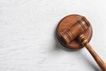 gavel on a table in a courtroom