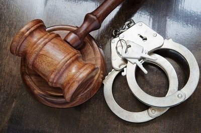 a gavel and handcuffs