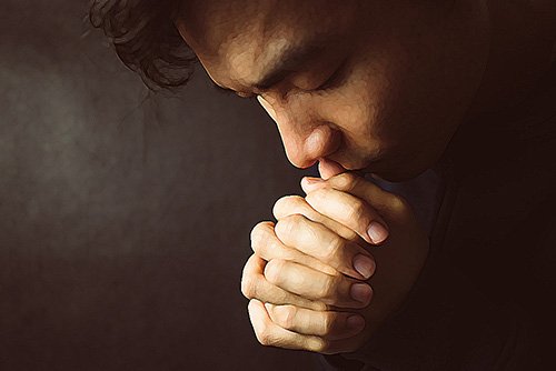 man praying for help