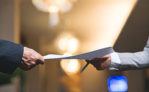 person handing over a legal document