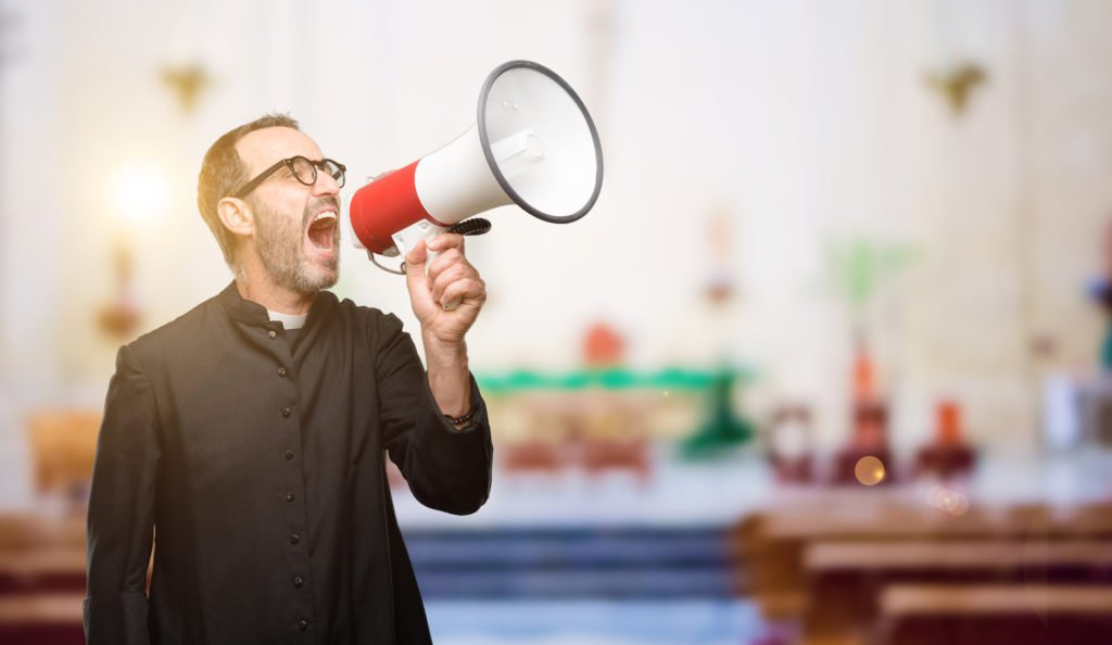 Man disturbing a meeting with a megaphone.