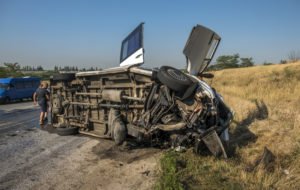 Overturned bus on a road