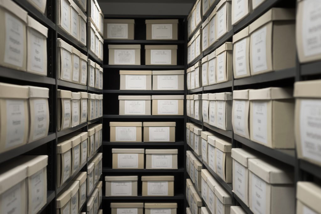 Shelves of banker boxes containing evidence
