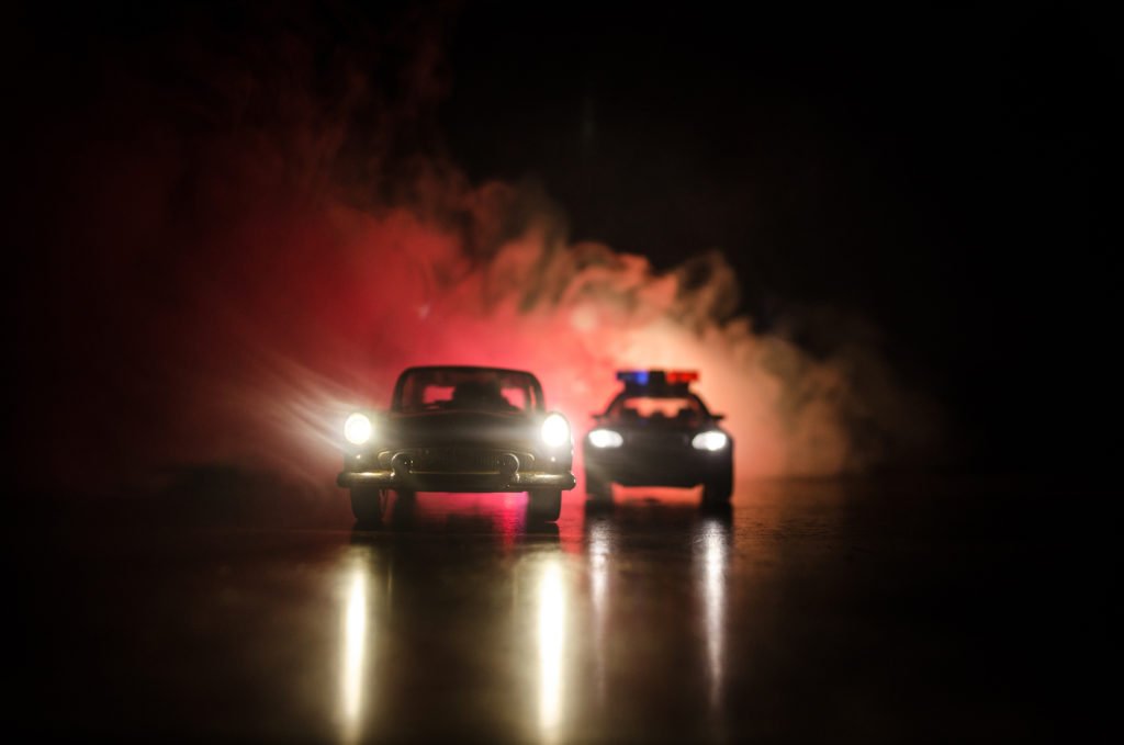 Car eluding a police vehicle at night as an example of a violation of CRS 42-4-1413