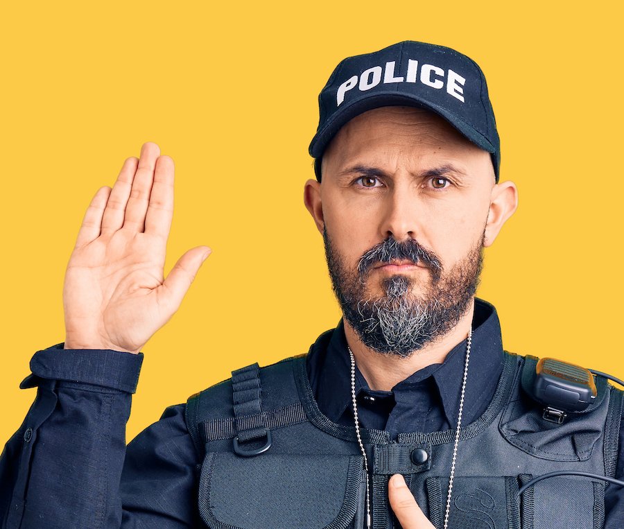 Policeman taking an oath during - officers frequently testify at DMV hearings in Colorado DUI cases