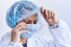 Tired hospital staff worker