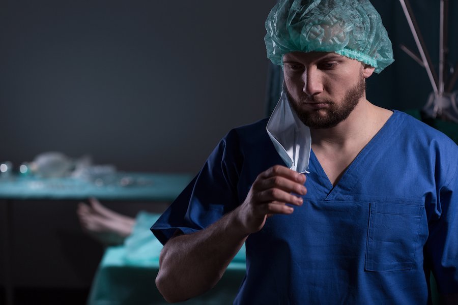 Despondent-looking medical provider in operating room