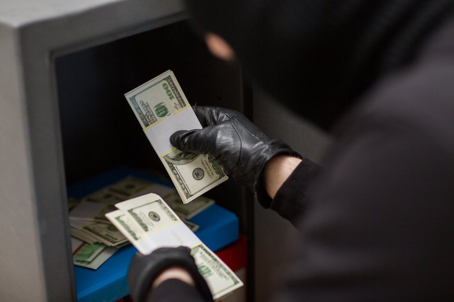 Man stealing cash from safe in violation of NRS 205.220.