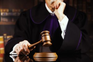 Judge holding a gavel.