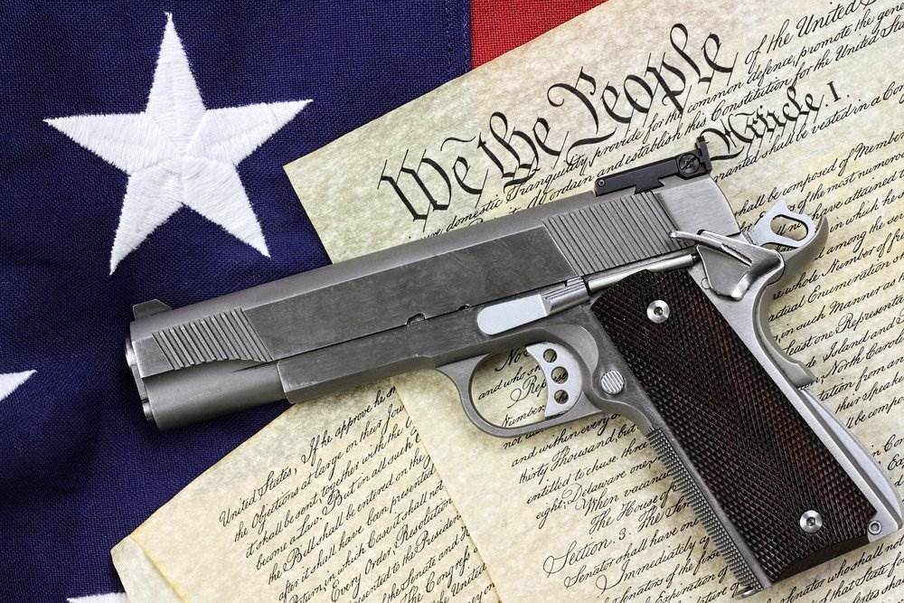 Gun placed on the US Constitution.