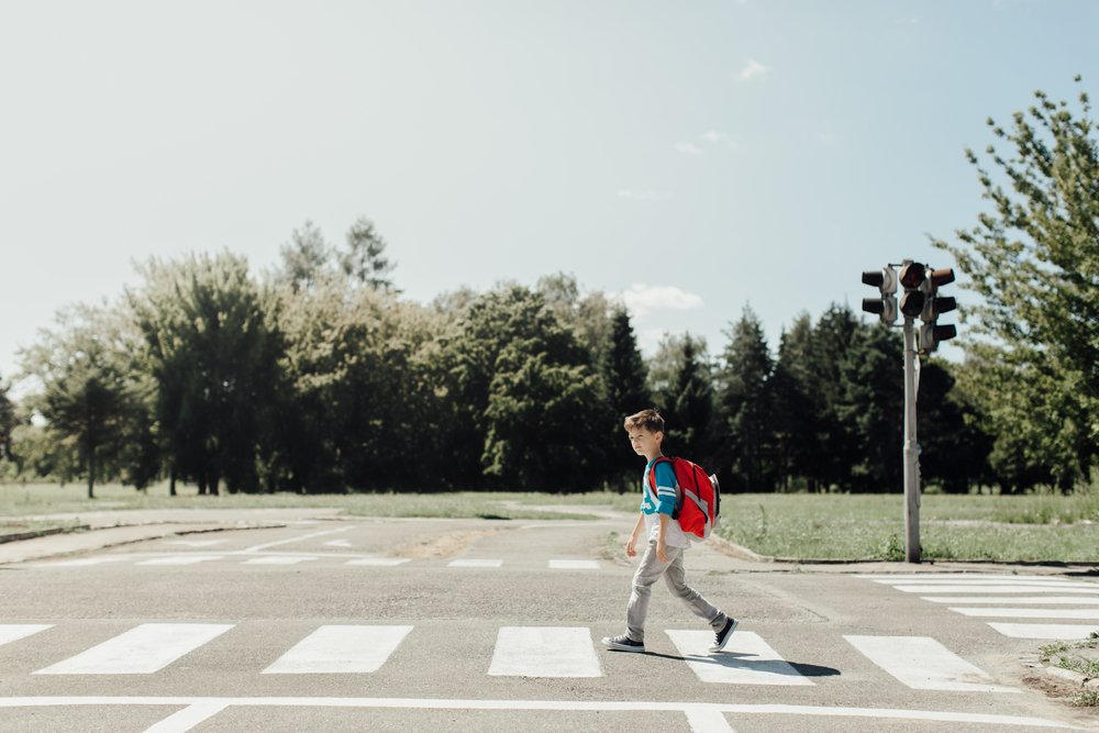 Kid walking to school.