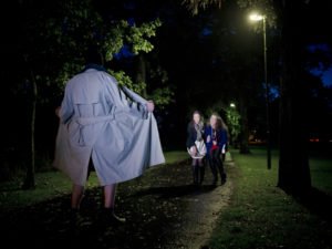 Man exposing himself to two surprised women.