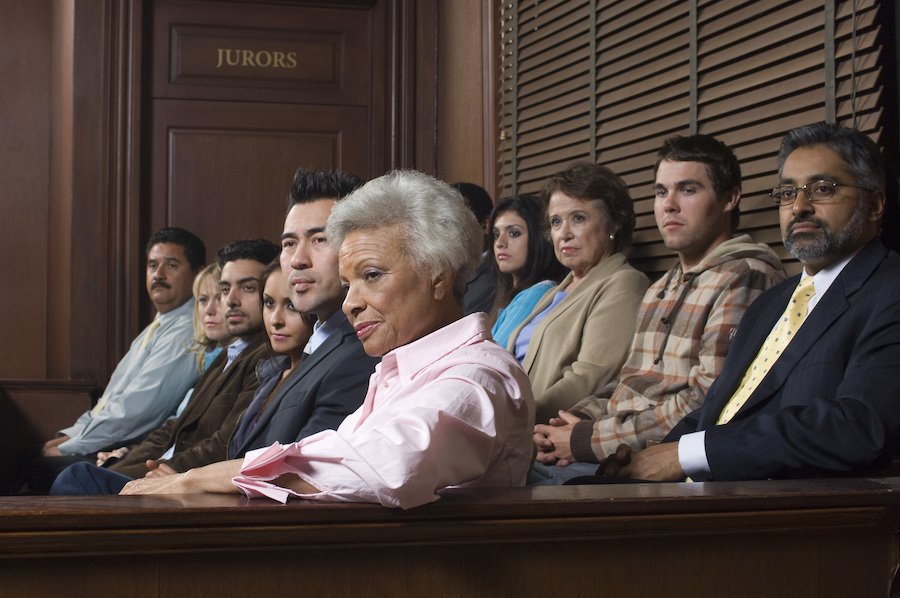 Jury in jury box listening to trial