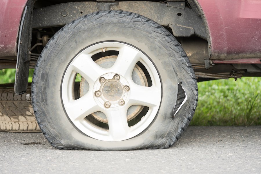Flat tire on the side of the road