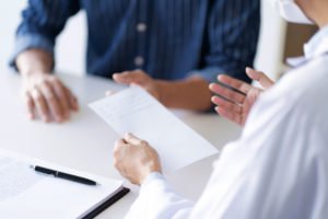 A hearing with two people.