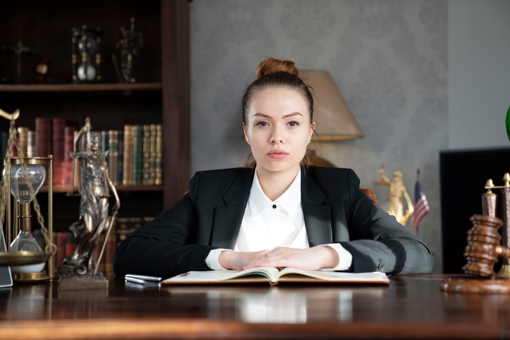 Attorney at desk with law book open