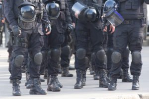 Special police unit in full gear and helmets - victims of police misconduct in Colorado can bring a civil rights lawsuit