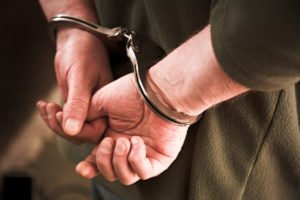 Man in cuffs.
