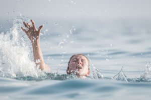 A young lady drowning.