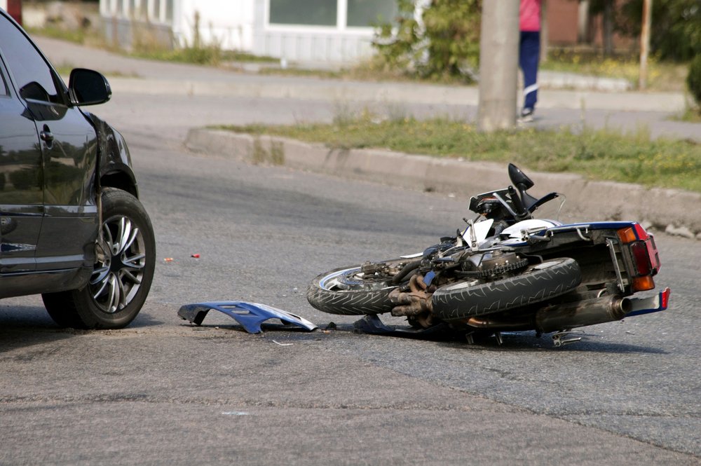A motorcycle accident scene involving an automobile - our California motorcycle attorneys help victims to sue for damages