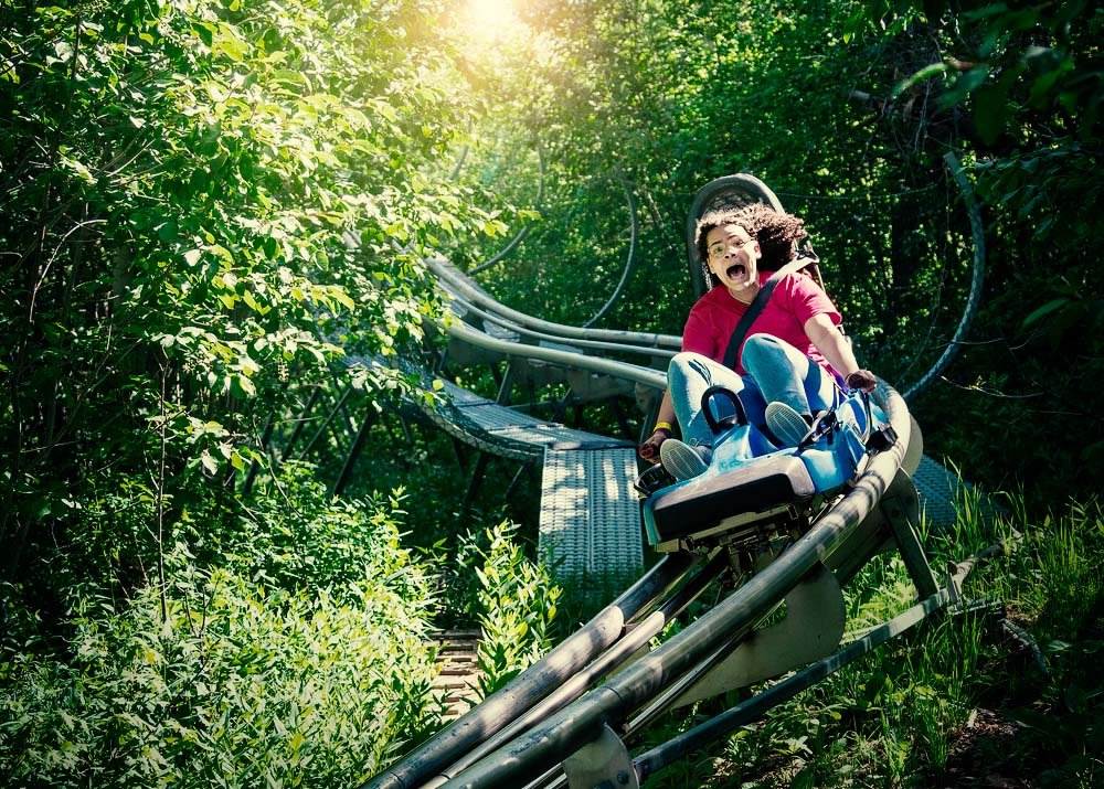 A young girl screaming while on an old roller coaster ride - our California amusement park accident lawyers help injury victims