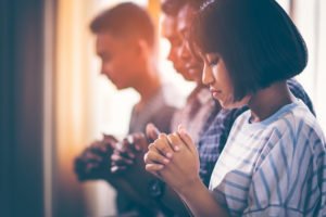 People praying during a religious service