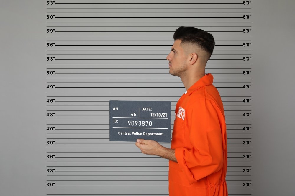 A inmate posing for a mugshot. A conviction for Penal Code 236 PC can lead to up to 3 years in jail.