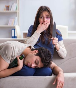 Domestic violence victim holding a knife after stabbing abusive significant other in lawful self-defense