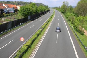 A car driving between two lanes.