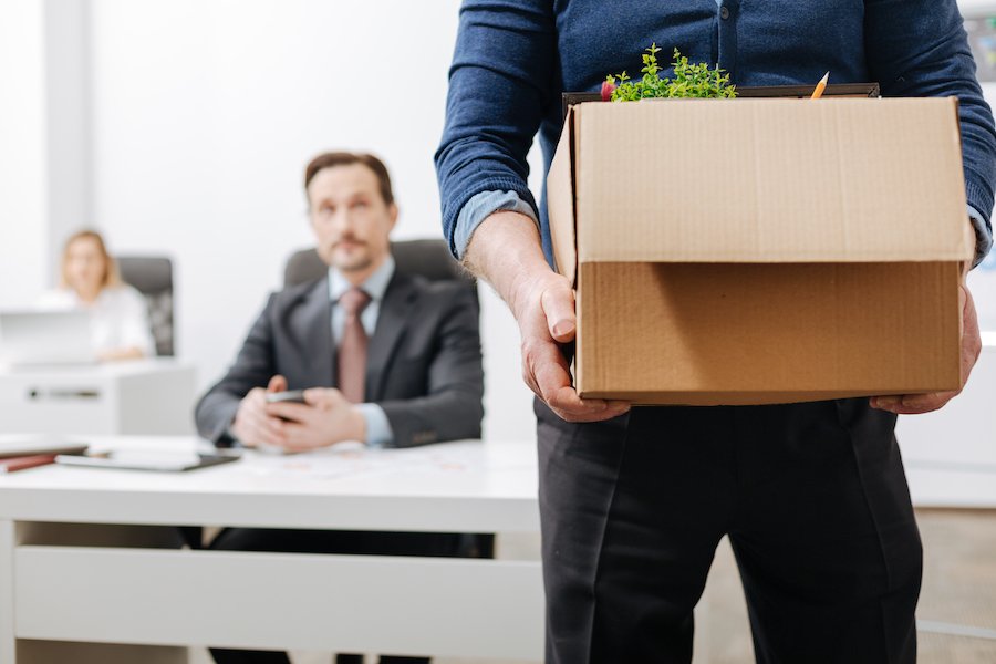 Employee who just quit carrying out box of office supplies