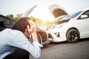 Man in despair following fender bender