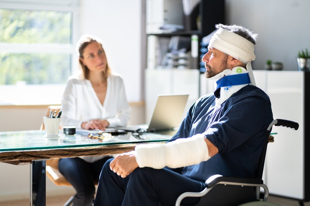 A Los Angeles attorney consulting with her head injury client.