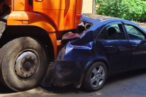 Aftermath of truck rear-ending sedan